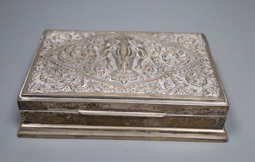 Three Thai white metal cigarette boxes, largest 16.1cm.